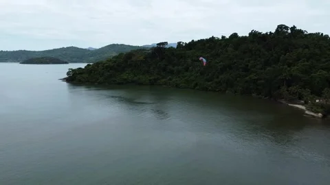 A Paramotor aircraft take a turn with stunning Brazilian back drop Video stock 328349657