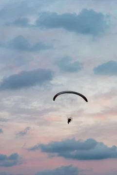 Paramotor flight in vertical sunset sky Stock Photos
