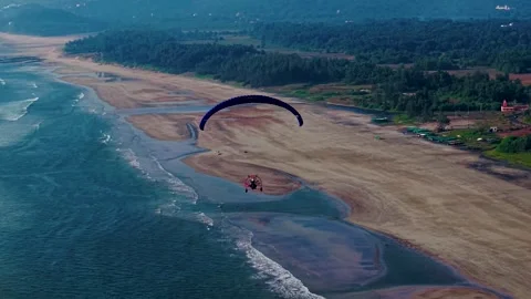 Paramotor Flying Over a Scenic Beach Shoreline (Aerial Drone View) Video stock 323943241
