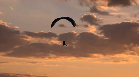 Paramotor Flying at Sunset and Beautiful Clouds Stock Footage 65218842