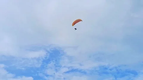 Paramotor on low angel shot. Paramotor with sky cloud. Indonesian Paramotor Stock Footage 307191524
