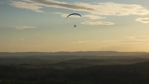 Paramotor over Moselle hills at sunset Stockbeeldmateriaal 332108880