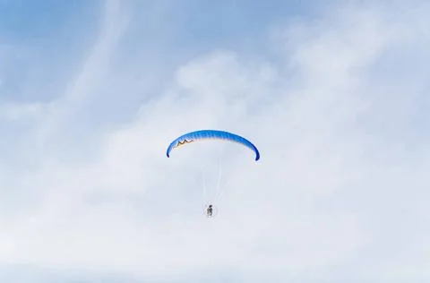 Paramotoring Paramotoring or microlight, paragliding against a blue sky. C... 写真素材