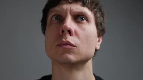 Paranoia and hypervigilance, man anxiously looking around in fear of unseen Stock Footage 323217207