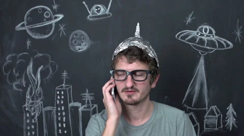 Paranoid alien conspiracy theorist on phone Stock Footage 32754341