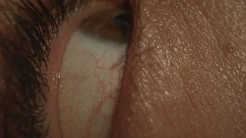 Paranoid eye looking around close up macro Stock Footage 129473311