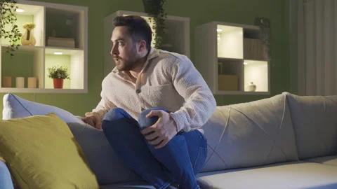 Paranoid man alone at home scared by hallucinations. Mental illness. Stock Footage 231011690