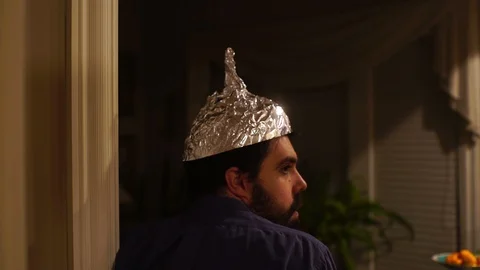 Paranoid man with a tin foil hat Video stock 105274356