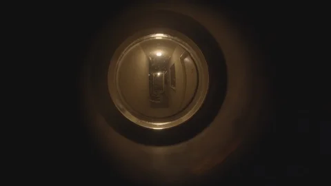 Paranoid view from apt door peep hole, looking for hidden danger Stock Footage 101440207