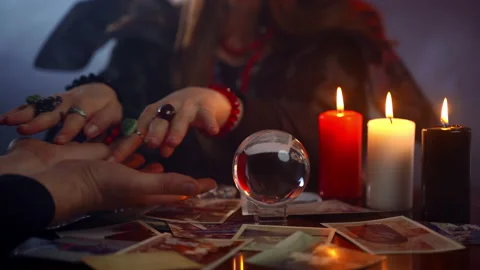 Paranormal phenomena and chiromancy in dark magic room, young fortune teller Video stock 131940468