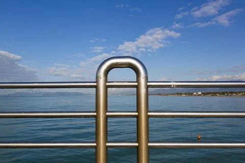 Parapet Close up view of the railing of a pier with marine landscape in th... 写真素材