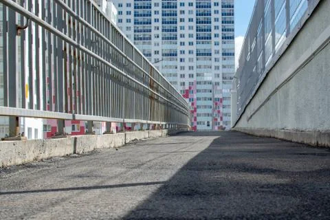 Parapet for the disabled with plain surface with wall mounted hand rails Stock Photos
