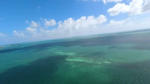 Parasail b roll of sky from 2 people Parasailing with green and blue ocean Stock Footage 205072607