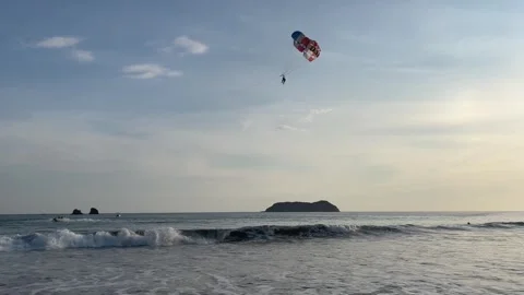 Parasailers being pulled by a boat Stockbeeldmateriaal 240682842