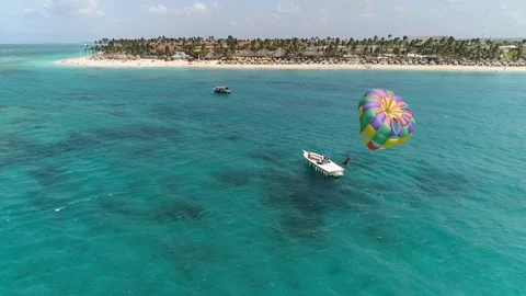 Parasailing Above Ocean Tropical Reef, Caribbean Resort Coast, Aerial Stock Footage 112464943
