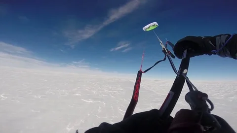 Parasailing on an arctic island Stock Footage 79978688