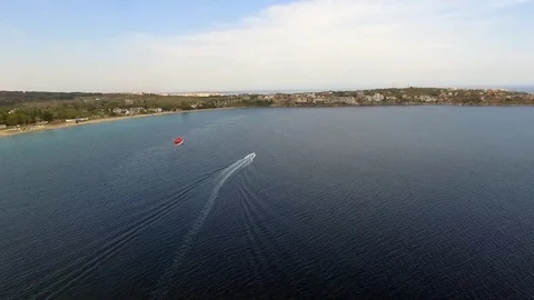 Parasailing in Black Sea in front of sandy beaches in Bulgaria Sozopol with wind Stock Footage 78772060