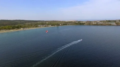 Parasailing in Black Sea in front of sandy beaches in Bulgaria Sozopol with wind Stock Footage 78772117
