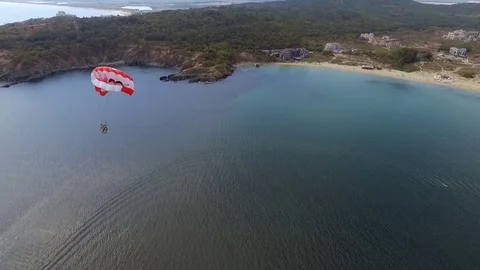 Parasailing in Black Sea in front of sandy beaches in Bulgaria Sozopol with wind Stock Footage 78772437