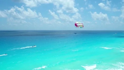 Parasailing in Blue Ocean in Front of Resort Hotels by Aerial Drone Stock-Footage 76413809