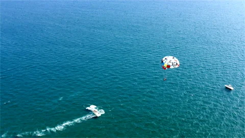 Parasailing boat trip with elements of free parachute flying Stock Footage 118632007