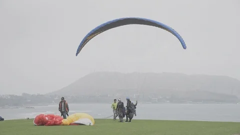 Parasailing by the coastline in Miraflores, Lima, Peru Stock Footage 90048853