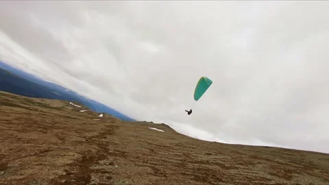 Parasailing Down the Mountain Slope in Norway, Aerial Drone View Stock Footage 151482829