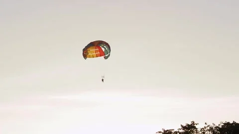 Parasailing in evening. Bright parachute on a background of a sky. 스톡 동영상 251901565