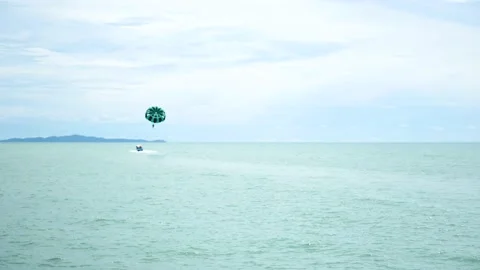 Parasailing - A fun, adventurous activity for a Couple. Tourist Attraction Stock Footage 142167351