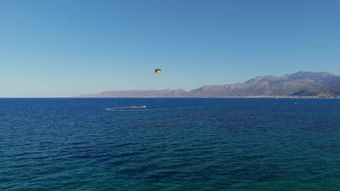 Parasailing Over Blue Waters in Crete 動画素材 299563171