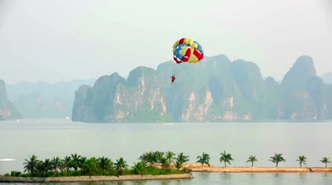 Parasailing over limestone mountain islands, Halong Bay, Vietnam Stock Footage 40434709