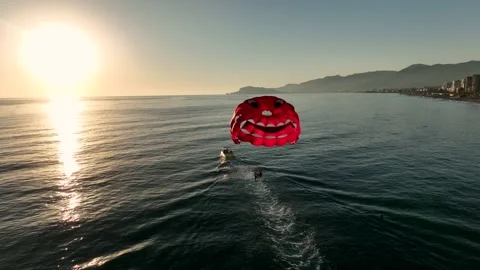 Parasailing over the mediterranean sea at the most beautiful sunset Stock Footage 223375498