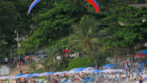 Parasailing over Nai Harn Beach, Phuket Stock Footage 101048010