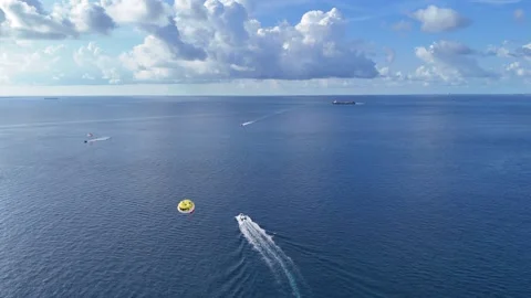 Parasailing Over Open Ocean Maldives Adventure Water Sports Aerial Video stock 332632937