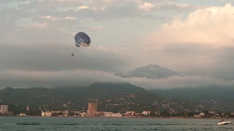 Parasailing Over Scenic Coast 스톡 동영상 305254592