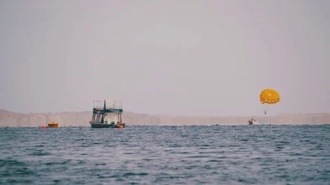 Parasailing, Parasailing Behind a Boat Stock Footage 71972804
