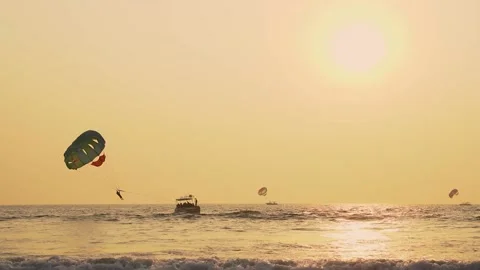 Parasailing before sunset at the beach in goa Stock Footage 151958935