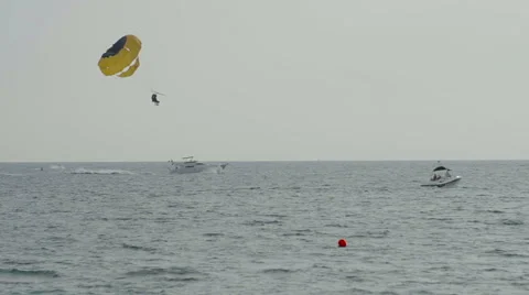 Parasailing at sunset Stock Footage 62564976