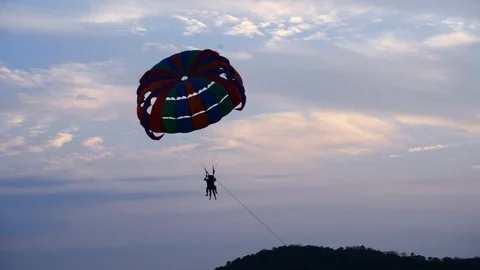 Parasailing at sunset Stockbeeldmateriaal 95800102