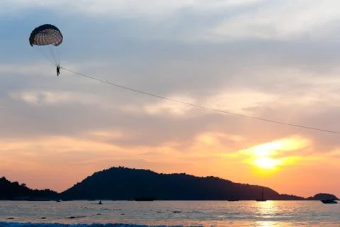 Parasailing at sunset Stock Photos
