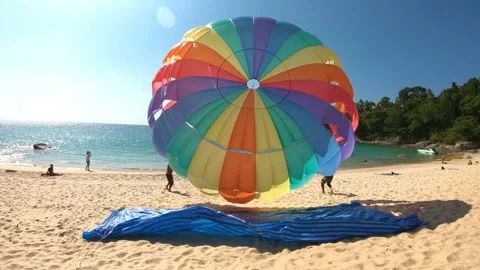 Parasailing take-off at the beach Stock Footage 124059482