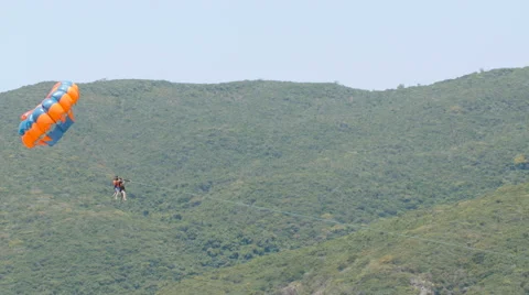 Parasailing tourists on vacations Stock Footage 62869543