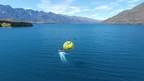 Parashoot on lake Stock Footage 100600828