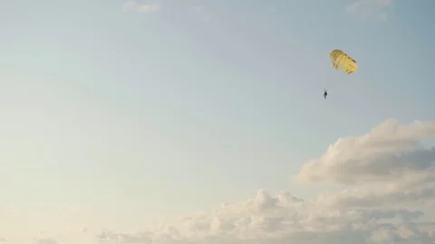 Parashute flying under the sea - Clouds and blue sky Stock Footage 118768215