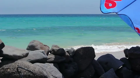 Parasol on the beach Stock Footage 37794312