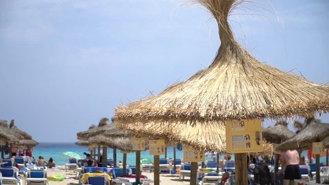 Parasol at the beach Stock Footage 128348902