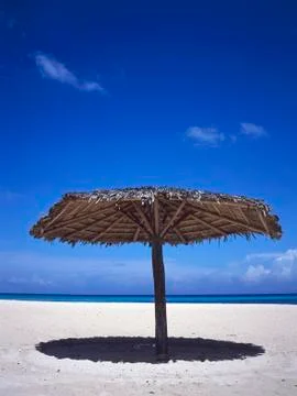 Parasol at the beach Stock Photos