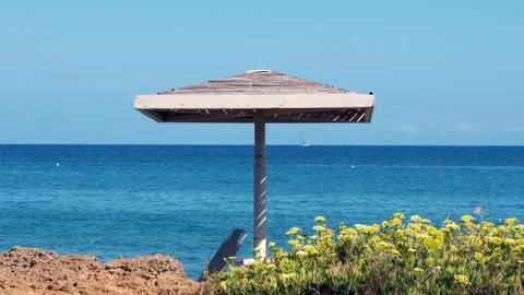 Parasol on the beach Stock Photos