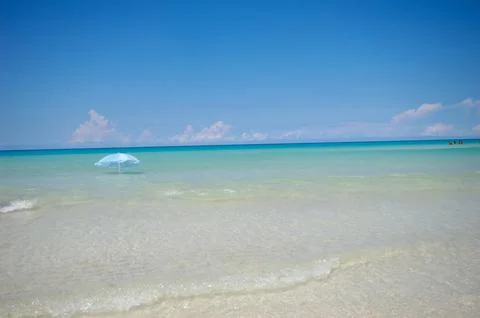 Parasol at exotic beach Stock Photos