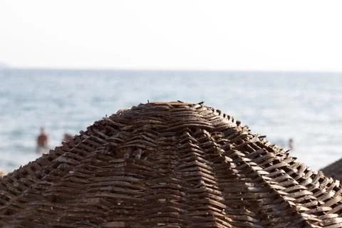 Parasol with place for text, copyspace left and sea in Background. Stock Photos